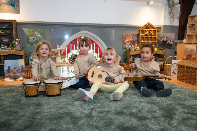 Children exploring natural resources in the Owls room
